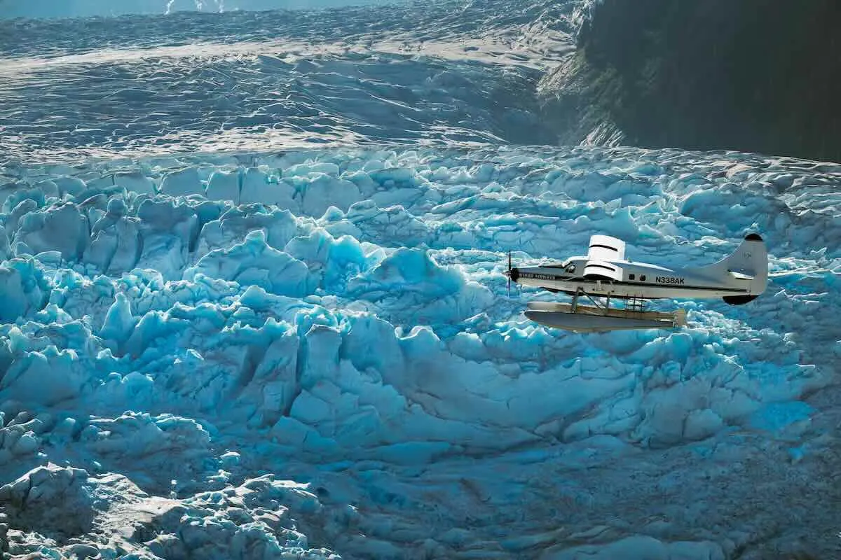 Floatplane flying over crevassed ice of the Juneau Icefield on a 5-glacier flightseeing tour near Mendenhall Glacier